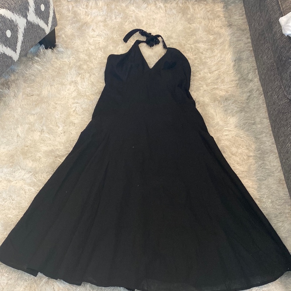 Never worn halter dress. See flaw in last picture.